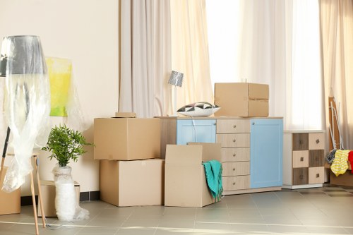 Movers handling furniture carefully during a safe removals job
