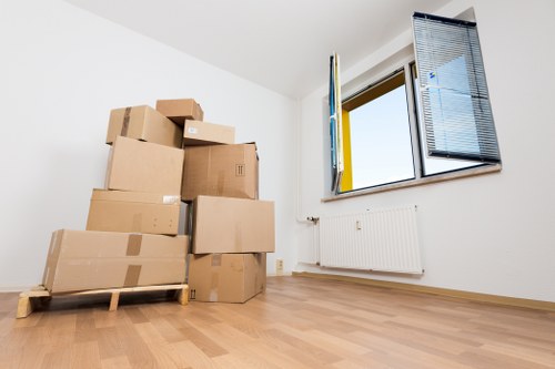 Unpacking boxes and arranging rooms in a new Ponders End home