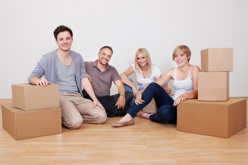 Careful packing and moving boxes during a house removal